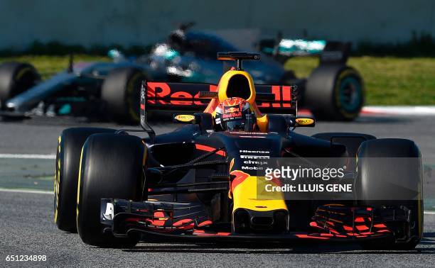 Red Bulls' Dutch driver Max Verstappen drives at the Circuit de Catalunya on March 10, 2017 in Montmelo on the outskirts of Barcelona on the fourth...