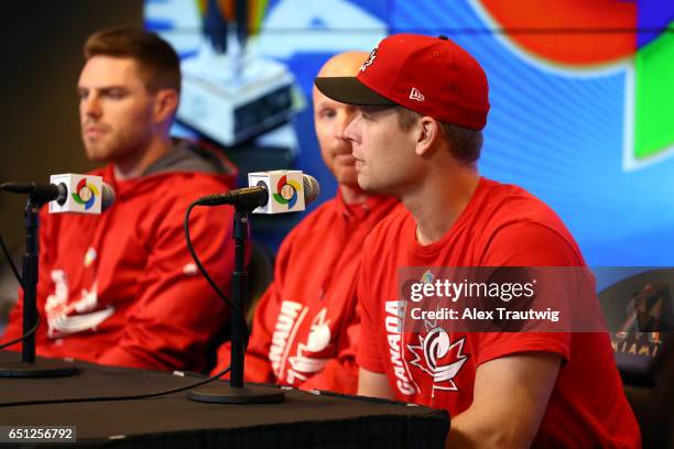 Freddie Freeman, Pete Orr, and Justin Morneau of Team Canada speak during the Pool C press conference for the World Baseball Classic on Thursday,...