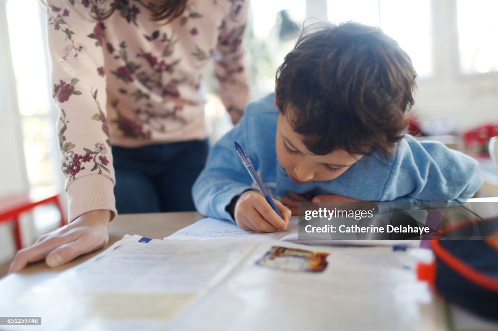 A boy doing his homeworks