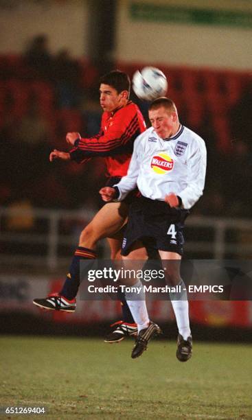 England's Tom Groves heads clear from Spain's Jaime Gavilan Martinez