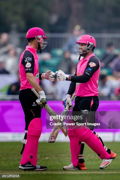 Johan Botha of Hung Hom JD Jaguars and Mohammad Naveed during the Hong Kong T20 Blitz match between Kowloon Cantons and Hung Hom JD Jaguars at Tin...