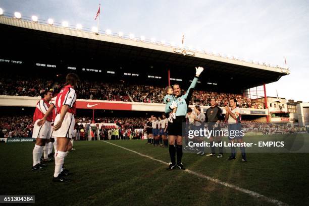 Arsenal's goalkeeper David Seaman waves to the Highbury crowd, whist holding his baby daughter Georgina, as the respective teams of Arsenal and...