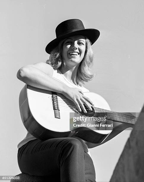 Italian actress Maria Pia Conte with her guitar Madrid, Spain. .