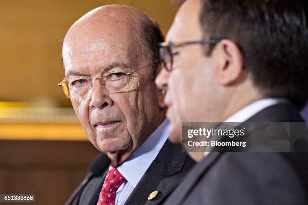 Wilbur Ross, U.S. Secretary of commerce, listens as Ildefonso Guajardo Villarreal, secretary of economy for Mexico, right, speaks during a news...