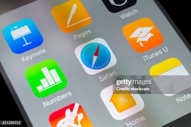 safari, numbers, itunes u and other apple apps on cellphone - browser stock pictures, royalty-free photos & images