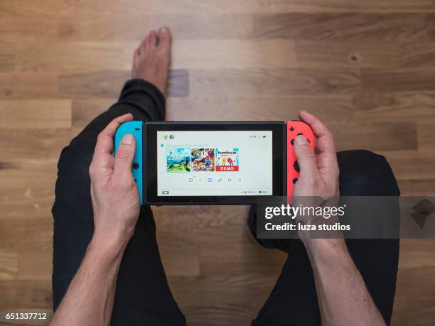 nintendo switch neon game console - switch stock pictures, royalty-free photos & images