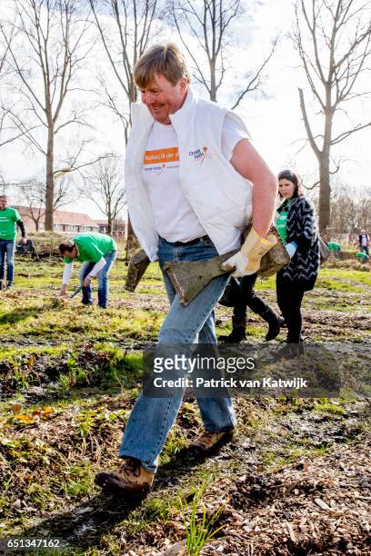 King Willem-Alexander of the Netherlands volunteering for NL Doet in the neighborhood garden on March 10, 2017 in Breda, Netherlands. NL Doet is a...