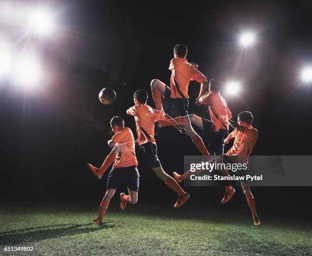 soccer player jumping to ball multiple exposure - multiple exposure sport stock pictures, royalty-free photos & images