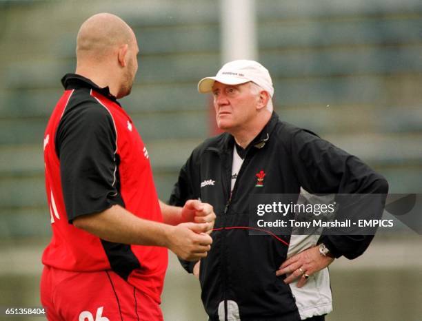 Wales coach Lynn Howells talking to Craig Quinnell during a light training session at the Prince Chichibu memorial Stadium