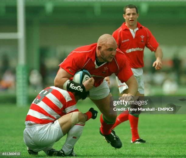 Wales' Craig Quinnell tackled by Japan's Wataru Murata