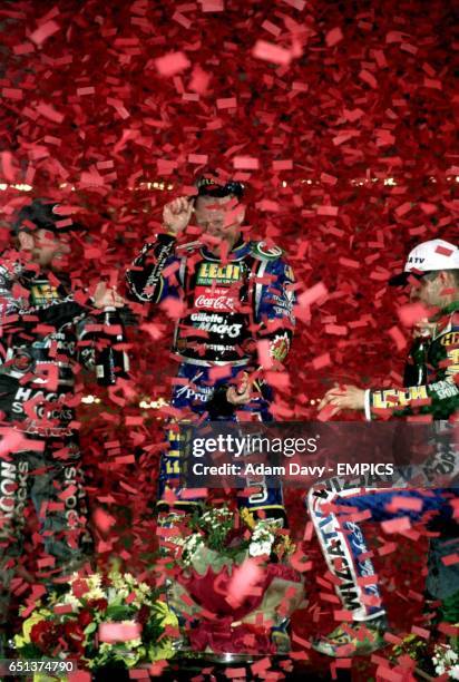 The winner of the British Grand Prix Tony Rickardsson , runner up Jason Crump and third placed Tomasz Gollob are drowned in confetti