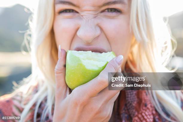 beautiful woman - woman eating fruit stock-fotos und bilder