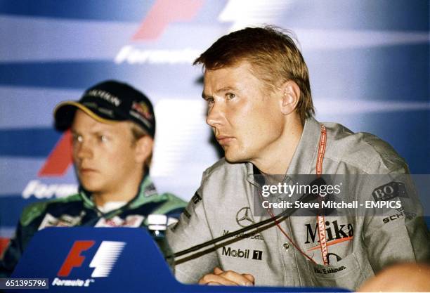 Kimi Raikkonen and Mika Hakkinen talk to the media at a press conference on practice day at the British Grand Prix