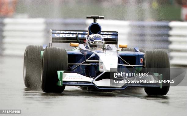 Kimi Raikkonen drives through the rain during the practice of the British Grand Prix