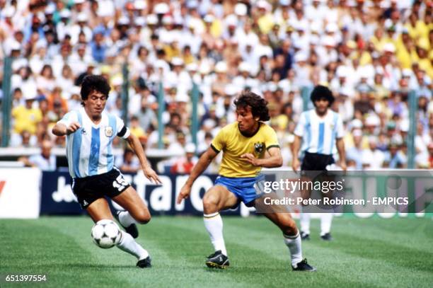 Brazil's Zico takes on Argentina's Daniel Passerella