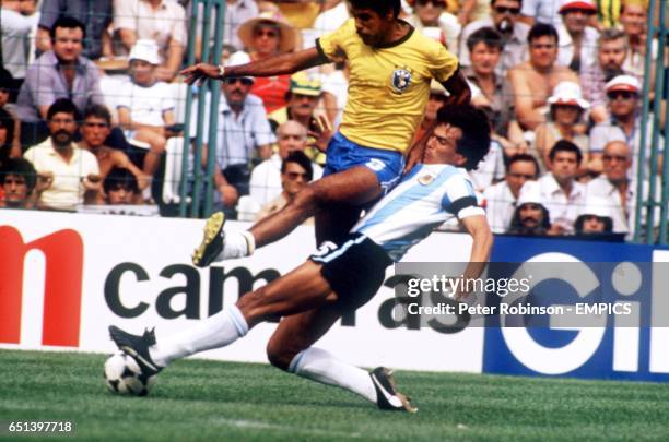 Brazil's Cerezzo is tackled by Argentina's Daniel Passerella