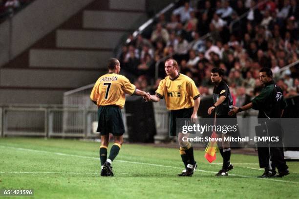 Celtic's John Hartson makes his Champions League debut as Henrik Larsson is substituted against Ajax
