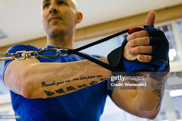 man exercising in a gym - forearm stock pictures, royalty-free photos & images