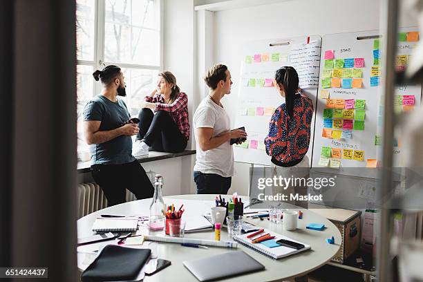 businesspeople at boardroom in creative office - responsabilité sociale photos et images de collection