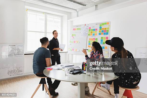 businessman explaining colleagues in board room - engineers brainstorming stock pictures, royalty-free photos & images