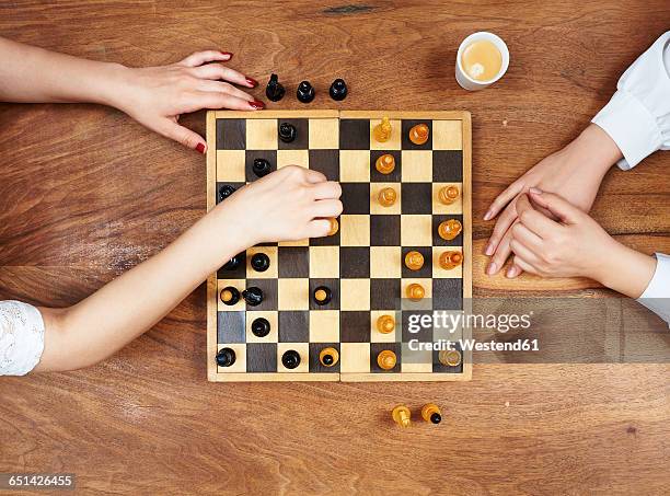 hands playing chess - chess board stock pictures, royalty-free photos & images