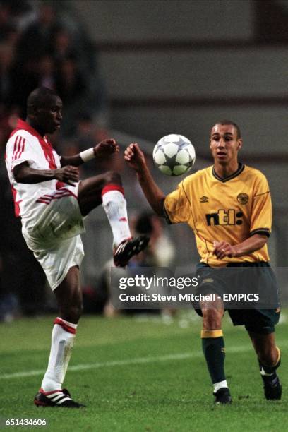 Ajax's Yakubu Abubakari clears from Celtic's Henrik Larsson