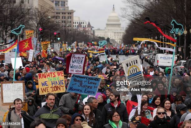 Activists participate in a protest against the Dakota Access Pipeline March 10, 2017 in Washington, DC. The Standing Rock Sioux Tribe held the event...