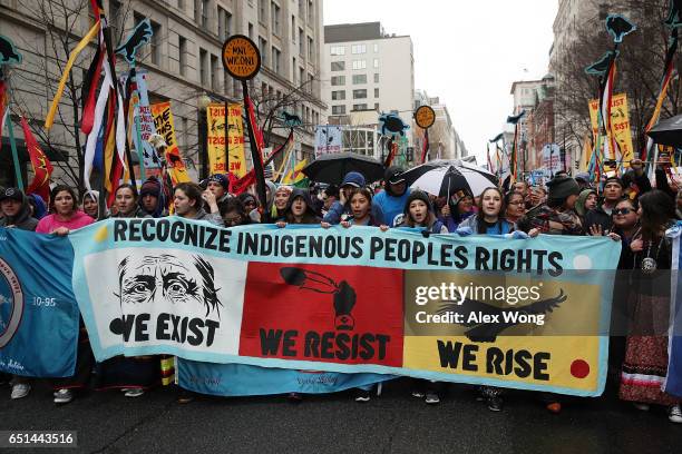 Activists participate in a protest against the Dakota Access Pipeline March 10, 2017 in Washington, DC. The Standing Rock Sioux Tribe held the event...