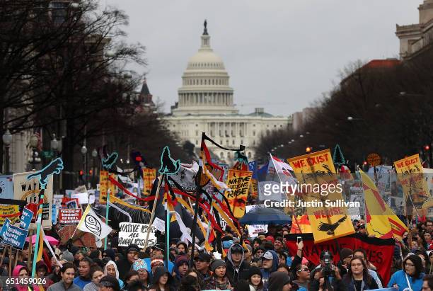 Protesters march during a demonstration against the Dakota Access Pipeline on March 10, 2017 in Washington, DC. Thousands of protesters and members...