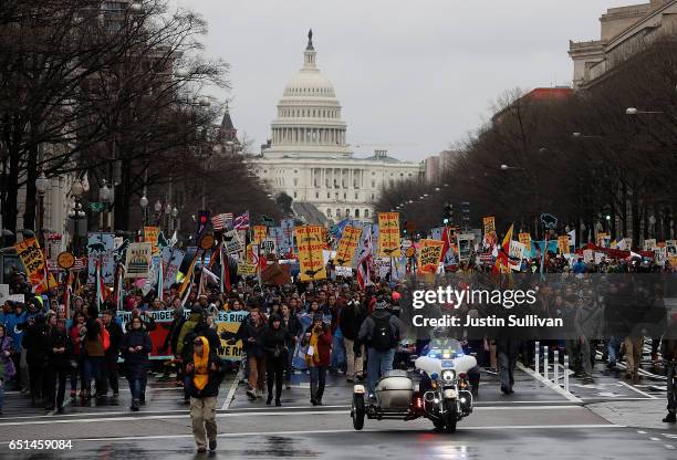 Protesters march during a demonstration against the Dakota Access Pipeline on March 10, 2017 in Washington, DC. Thousands of protesters and members...