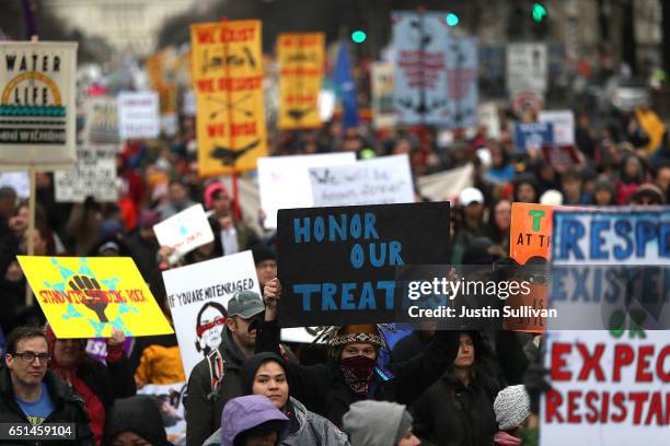 Protesters march during a demonstration against the Dakota Access Pipeline on March 10, 2017 in Washington, DC. Thousands of protesters and members...