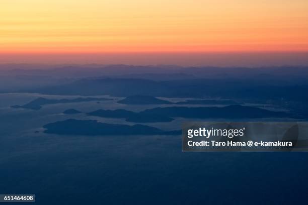islands in seto inland sea, sunset aerial view from airplane - kudamatsu stock pictures, royalty-free photos & images