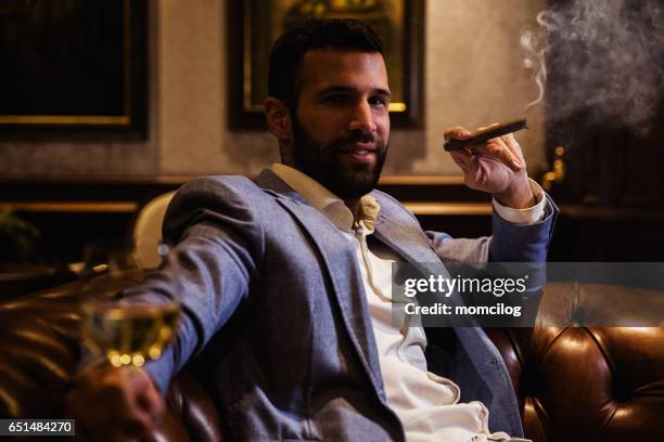 passionate smoker - cigar smokers stock pictures, royalty-free photos & images