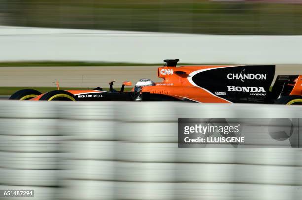 McLaren's Spanish driver Fernando Alonso drives at the Circuit de Catalunya on March 10, 2017 in Montmelo on the outskirts of Barcelona on the fourth...
