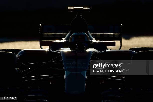 Red Bulls' Dutch driver Max Verstappen drives at the Circuit de Catalunya on March 10, 2017 in Montmelo on the outskirts of Barcelona on the fourth...