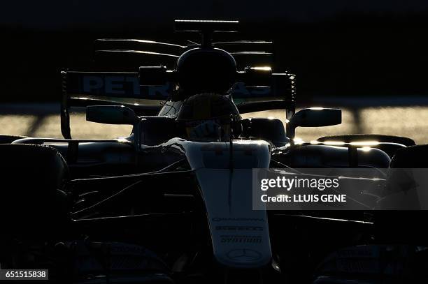 Mercedes AMG Petronas F1 Team's British driver Lewis Hamilton drives at the Circuit de Catalunya on March 10, 2017 in Montmelo on the outskirts of...