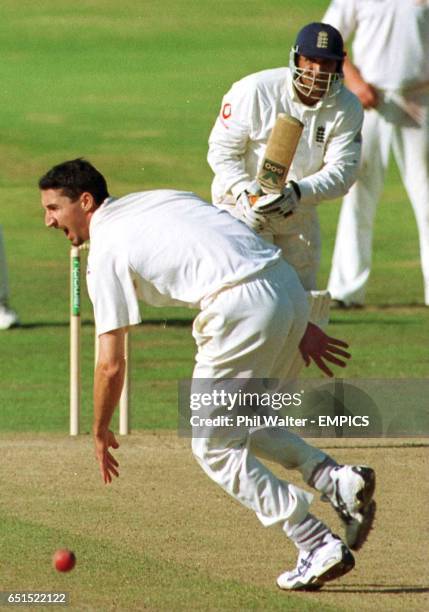 England's Mark Butcher pushes the ball past Australia's Jason Gillespie as he heads his side to victory in the 4th ASHES test.