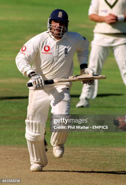 England's Mark Butcher makes up the runs as he leads England to victory over Australia in the 4th ASHES.