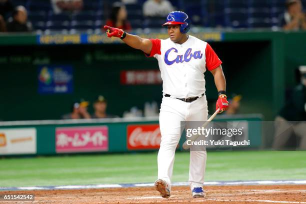Alfredo Despaigne of Team Cuba points dugout after hitting a gland slam in the fifth inning during Game 5 of Pool B of the 2017 World Baseball...