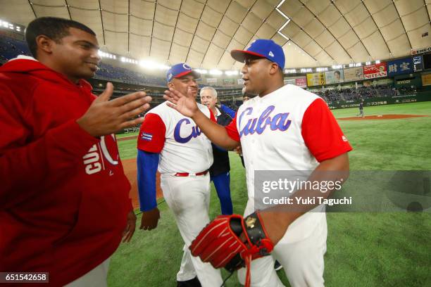 Alfredo Despaigne of Team Cuba celebrates with teammates after after winning Game 5 of Pool B of the 2017 World Baseball Classic against Team...