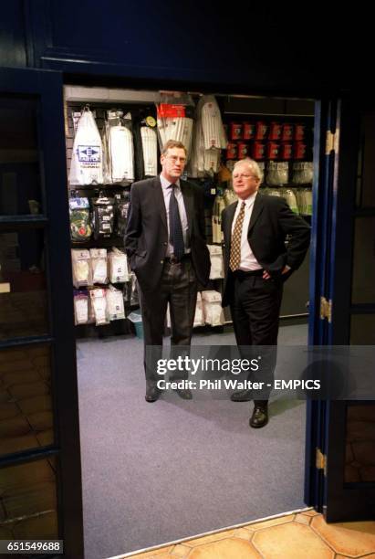 Surrey Chief Executive Paul Sheldon , seen through the shop door