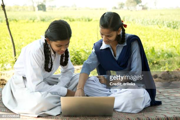 school girls using laptop - village stock pictures, royalty-free photos & images