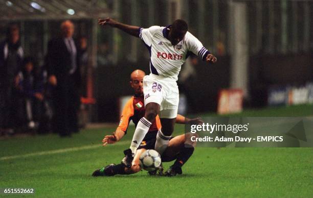 Roma's Antonio Zago slides in on Anderlecht's Aruna Dindane