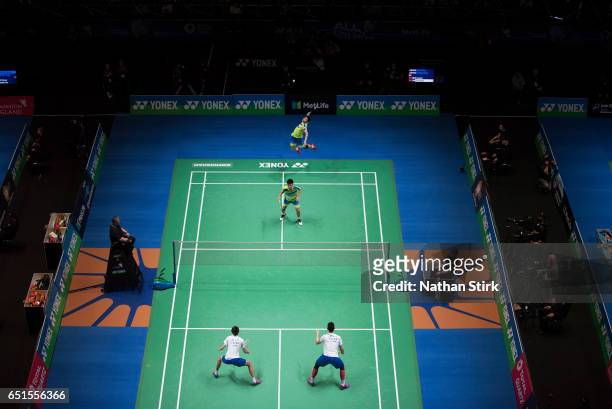 Wee Kiong Tan and V Shem Goh of Malaysia competes with Liu Yuchen and Li Junhui of China in their mens doubles quarter final match during day four of...