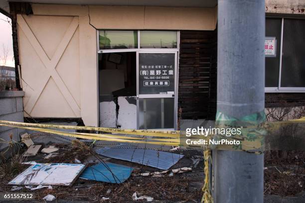 Destroyed office is still left behind in front of Namie train station in Fukushima prefecture at 10 March 2017. Six years have passed since the Great...