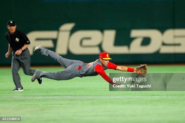 Joey Wong of Team China makes a diving attempt to catch the ball in the first inning during Game 6 of Pool B against Team Japan at the Tokyo Dome on...