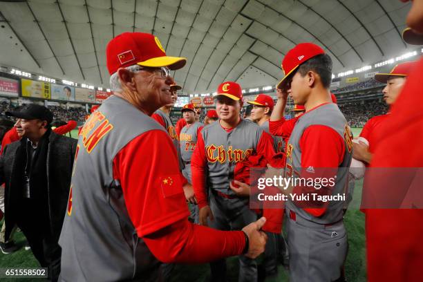 Manager John McLaren of Team China shakes hands with players after China's final game of Pool B of the 2017 World Baseball Classic against Team Japan...