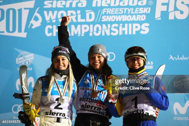 Silver medalist Danielle Scott of Australia, gold medalist Ashley Caldwell of the United States and bronze medalist Mengtao Xu of China celebrate...