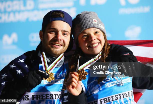 Gold medalists Jonathon Lillis of the United States and Ashley Caldwell of the United States celebrate on the podium during the medal ceremony for...