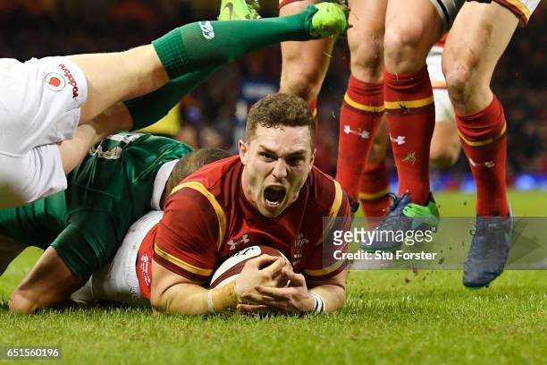 George North of Wales celebrates after scoring the opening try during the Six Nations match between Wales and Ireland at the Principality Stadium on...